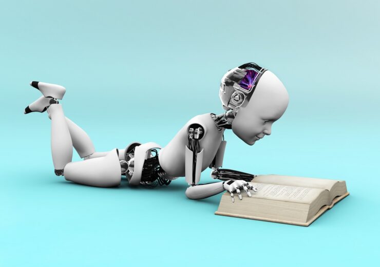 Robot,Child,Lying,On,The,Floor,And,Reading,A,Book.